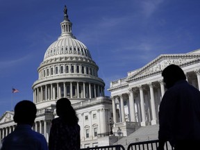 FILE - People walk outside the U.S. Capitol building in Washington on June 9, 2022. Members of the House and Senate were informed Wednesday, March 8, 2023, that hackers may have gained access to their sensitive personal data in a breach of a Washington, D.C., health insurance marketplace.