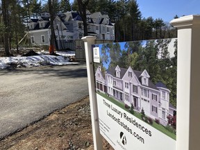 A sign announces newly built homes at a development in Sudbury, Ma., on Sunday, March 12, 2023. On Thursday, Freddie Mac reports on this week's average U.S. mortgage rates.