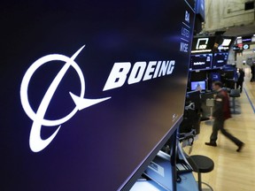 FILE - In this March 11, 2019 file photo, the Boeing logo appears above a trading post on the floor of the New York Stock Exchange. Saudi Arabia is buying up to 121 jetliners from Boeing in a big boost for the American manufacturer. The deal was expected to be announced Tuesday, March 14, 2023.