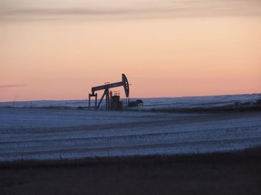 FILE - A pump jack for pulling oil from the ground is seen near New Town, N.D., Feb. 25, 2015. On Monday, March 27, 2023, a federal judge ordered the United States government to resume oil and gas lease sales on federal lands in North Dakota as a legal battle continues over the Biden administration's pause on the federal leasing program two years ago in an effort to combat climate change.