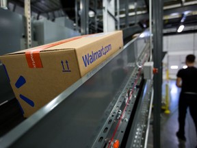 A package moves along a conveyor belt inside a Walmart warehouse in Pennsylvania.