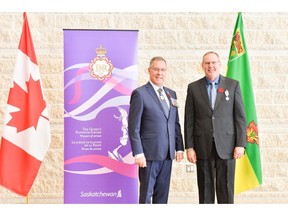 The Hon. Russ Mirasty, Lt. Gov. of Saskatchewan, awards the Queen Elizabeth II Platinum Jubilee Medal to Roy LaBuick, owner, Minuteman Press, Moose Jaw, SK.