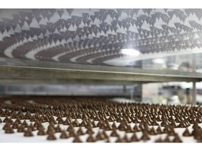Hershey Kisses chocolate candies move along a conveyor at the Hershey factory in Hershey, on March 21. Photographer: Ryan Collerd/Bloomberg