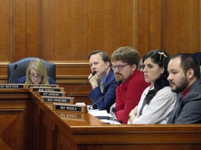 Democratic state Reps., from left, Denise Mentzer, Matt Koleszar, Joey Andrews, Jaime Churches and Dylan Wegela, listen as testimony is given during a House Labor Committee meeting, Wednesday, March 8 , 2023, in Lansing, Mich., on repealing the state's right-to-work law and restoring prevailing wages.