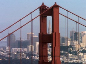The Transamerica Pyramid Building is framed by San Francisco, California's Golden Gate Bridge.