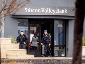 Police officers leave Silicon Valley Banks headquarters in Santa Clara, Calif., on March 10, 2023.