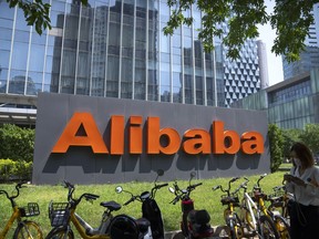 FILE - The logo of Chinese technology firm Alibaba is seen at its office in Beijing on Aug. 10, 2021. The CEO of Chinese e-commerce and financial giant Alibaba said Thursday that the company is moving toward giving up control of some of its business units in a transition toward becoming a capital operator to optimize the value of its sprawling businesses.