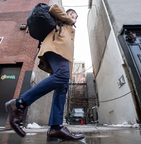 A pedestrian walks past the laneway behind 185 King Street East in Toronto that became the focus of a legal battle.