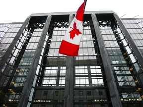 After years of sitting at rock bottom levels, higher interest rates are forcing Canadians with debt to pay more and crimping budgets, but for investors in need of income from their portfolio, higher rates are a welcome sight. The Bank of Canada building is pictured in Ottawa on Tuesday, Dec. 6, 2022.