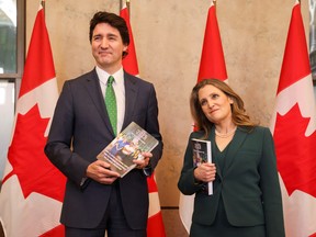 Prime Minister Justin Trudeau and Finance Minister Chrystia Freeland speak to the media, holding the 2023-24 budget, on Parliament Hill in Ottawa, on March 28.