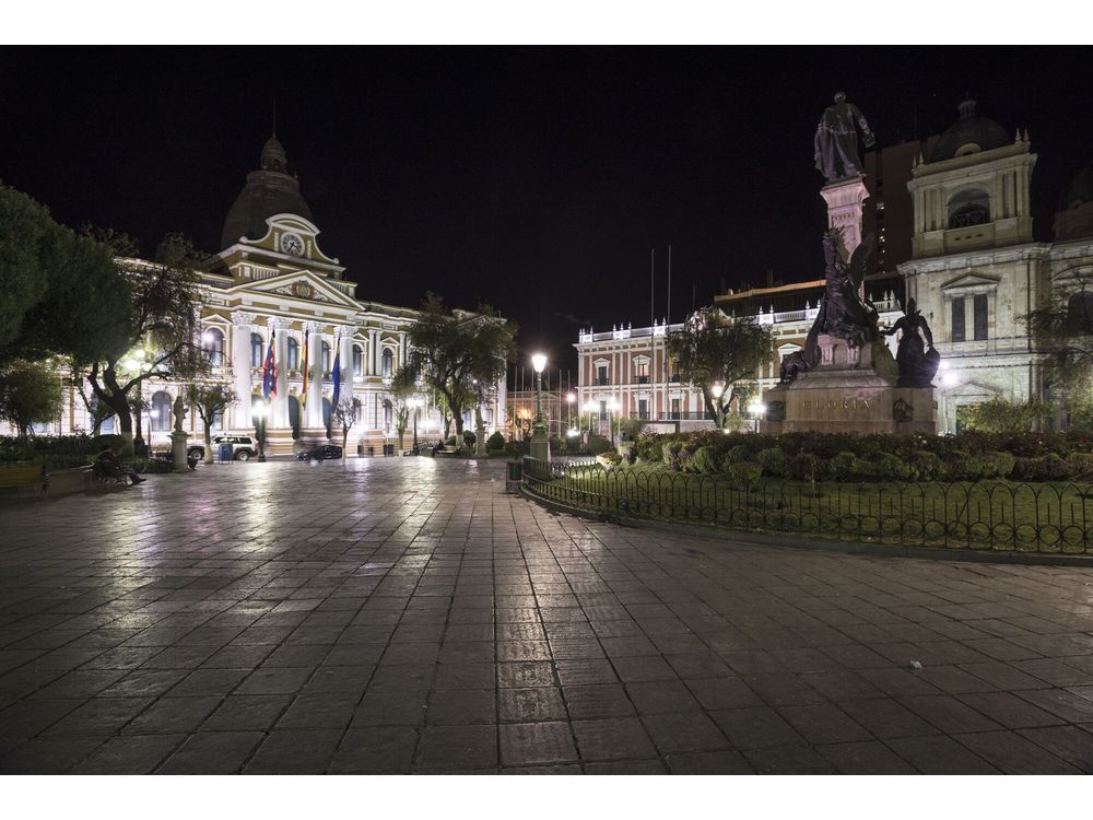The National Congress of Bolivia, or Palacio Legislativo, left, the Presidential Palace, or Palacio de Gobierno, and the Cathedral of La Paz stand at Plaza Murillo in La Paz, Bolivia, on Tuesday, Sept. 6, 2016. La Paz is the highest capital city in the world with an elevation of roughly 11,975 feet above sea level and with an average elevation of 13,615 feet, and El Alto is the highest major metropolis. Photographer: Marcelo Perez del Carpio/Bloomberg