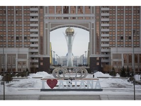 The Bayterek tower monument, center, stands beyond the headquarter offices of KazMunaiGaz National Co., the state-owned oil and gas company, in Astana, Kazakhstan, on Wednesday, Nov. 23, 2016. Kazakhstan's central bank is planning to review bank assets by the end of next year to help boost financial stability and spur lending that's needed to lift the economy of the former Soviet Union's second-biggest energy producer after its worst year since 1998. Photographer: Andrey Rudakov/Bloomberg