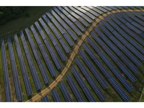 Solar panels stand at the Dominion Energy Inc. Selmer solar generating facility in this aerial photograph taken above Selmer, Tennessee, U.S., on Wednesday, May 23, 2018. Large oil companies in Europe are continuing to diversify their holdings and increase clean-energy investments. Royal Dutch Shell Plc agreed in January to buy a 44 percent stake in Silicon Ranch Corp., the Nashville-based owner and operator of U.S. solar plants.