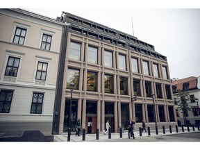 Pedestrians pass the entrance to Norway's central bank, also known as Norges Bank, in Oslo, Norway, on Wednesday, Sept. 4, 2019. Slyngstad, the man managing Norway's $1 trillion wealth fund is looking beyond the current political turmoil, vowing to invest in the U.K. "no matter what" and planning to plow another $100 billion into the U.S. stock markets.