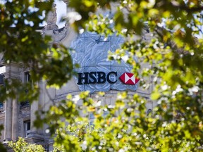 A logo sits on display at the HSBC Holdings Plc headquarters on Champs Elysee in Paris, France, on Wednesday, July 29, 2020. HSBC is in the process of selling its French retail banking arm, which comprises 250 branches and several thousand employees.