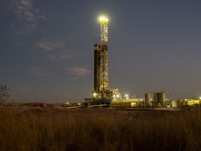 An oil drilling rig operates near Midland, Texas, U.S., on Saturday, Jan. 29, 2022.  Photographer: Matthew Busch/Bloomberg