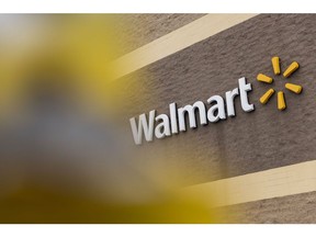 Signage outside a Walmart store in Albany, New York, U.S., on Thursday, Feb. 17, 2022. Walmart Inc. surpassed Wall Street's quarterly profit expectations and unveiled an upbeat sales outlook for the current fiscal year despite persistent cost pressures and flagging consumer sentiment.