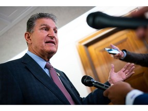 Senator Joe Manchin, a Democrat from West Virginia and chairman of the Senate Energy and Natural Resources Committee, speaks to members of the media prior to a hearing in Washington, D.C., US, on Tuesday, July 19, 2022. The hearing is to examine "federal regulatory authorities governing the development of interstate hydrogen pipelines, storage, import, and export facilities."