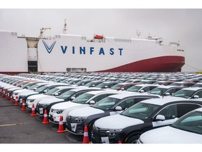 VinFast LLC's VF8 electric vehicles bound for shipment at a port in Haiphong, Vietnam, on Friday, Nov. 25, 2022. VinFast, which said in July that it had signed agreements with banks to raise at least $4 billion to help its US expansion, has about 73,000 global reservations for its EVs, according to the company. It has secured about $1.2 billion in incentives for its planned EV factory in North Carolina, where it intends to start production in 2024, according to the auto manufacturer.