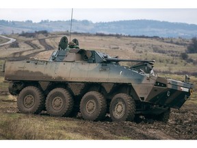 Polish soldiers in a KTO Rosomak armored personnel carrier,