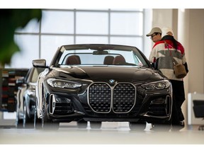Customers at a BMW dealership in Mountain View, California. Photographer: David Paul Morris/Bloomberg
