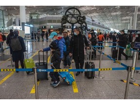 Passengers at Beijing Capital International Airport in Beijing in January. Source: Bloomberg
