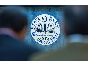 The emblem of the State Bank of Pakistan during a news conference in Karachi, Pakistan, on Monday, Jan. 23, 2023. Pakistan increased its benchmark interest rate to 17%, the highest in more than 24 years, as the economy grapples with raging inflation, supply shortages, dwindling currency reserves and stalled foreign financing. Photographer: Asim Hafeez/Bloomberg