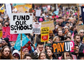 Striker teachers attend a protest during strike action in London, in February.