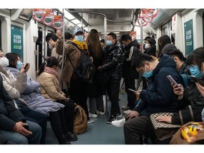 Commuters ride a subway train in Beijing, China, on Wednesday, Feb. 15, 2023. President Xi Jinping's push for a consumer-led economic recovery has hit a new barrier: Chinese citizens misusing cheap consumer loans.