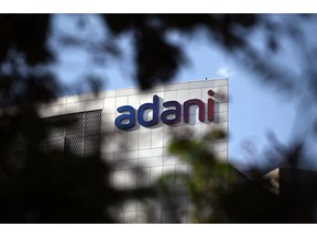 Signage atop the Adani Group headquarters in Ahmedabad, India, on Wednesday, March 8, 2023. A meeting was held in London Wednesday, as a part of a worldwide roadshow aimed at reassuring international investors that the ports-to-power empire's finances are under control, after as much as $153 billion in combined market value was erased from company stocks following a January short seller's report. Photographer: Prakash Singh/Bloomberg