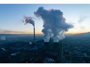 Smoke and water vapor from the Ulaanbaatar Thermal Power Plant No. 4 combined heating and power plant at dawn in Ulaanbaatar, Mongolia, early on Sunday, March 12, 2023. This year, China's removal of Covid Zero restrictions could provide a boost to Mongolia's economy, ending a drag on trade.