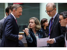Christian Lindner, Germany's finance minister, left, Nadia Calvino, Spain's finance minister, center, and Tuomas Saarenheimo, chairman of the economic and financial committee at the European Commission, during a Eurogroup meeting at the European Council headquarters in Brussels, Belgium, on Monday, March 13, 2023. European Union finance ministers will emphasize the role governments have in reining in consumer price increases alongside the bloc's central bank, Eurogroup President Paschal Donohoe said. Photographer: Valeria Mongelli/Bloomberg