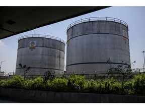Silos at an oil refinery operated by Bharat Petroleum Corp. Ltd., in Mumbai, India, on Tuesday, April 4, 2023. A surprise cut in oil production from OPEC+ is now setting the stage for other producers to vie for markets in Asia. Photographer: Dhiraj Singh/Bloomberg