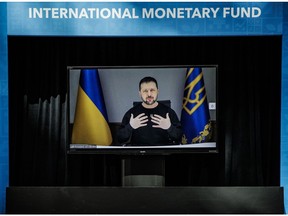 Volodymyr Zelenskiy, Ukraine's president, displayed on a monitor while speaking virtually during a roundtable discussion for support to Ukraine at the spring meetings of the International Monetary Fund (IMF) and World Bank Group in Washington, DC, US, on Wednesday, April 12, 2023. The IMF trimmed its global-growth projections, warning of high uncertainty and risks as financial-sector stress adds to pressures emanating from tighter monetary policy.