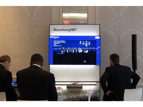 Attendees watch a live stream during the BNEF summit in New York, US, on Monday, April 24, 2023. The BNEF Summit provides the ideas, insights and connections to formulate successful strategies, capitalize on technological change and shape a cleaner, more competitive future.