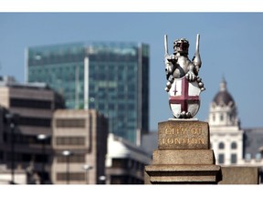 A statue of a Griffin carrying the coat of arms of the City of London. Photographer: Chris Ratcliffe/Bloomberg