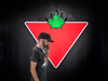 Man walks in front of Canadina Tire logo