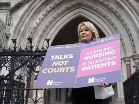 General Secretary of the Royal College of Nursing, Pat Cullen joins nurses outside the High Court in central London, where the government is bringing a challenge over the planned strike action by the Royal College of Nurses (RCN), in London, Thursday April 27, 2023. Britain's High Court has ruled that part of a strike by thousands of nurses planned for next week is illegal. The ruling is a small victory to the government in its bitter dispute with public sector unions.