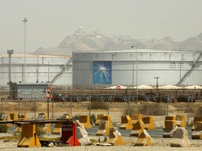 FILE - Storage tanks are seen at the North Jiddah bulk plant, an Aramco oil facility, in Jiddah, Saudi Arabia, on March 21, 2021. Saudi Arabia's crown prince announced Sunday the transfer of a 4% stake of the oil giant Saudi Aramco to a subsidiary of the kingdom's sovereign wealth fund, further boosting its coffers as the kingdom tries to expand its economy beyond oil.