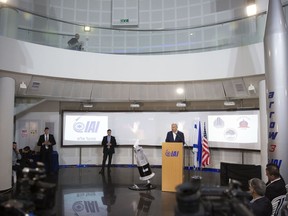 FILE - Israeli Prime Minister Benjamin Netanyahu speaks at the Israel Aerospace Industries (IAI) MLM Division plant to communicate that Israel has successfully tested the Arrow-3 interceptor, the country's advanced missile defense system capable of defending against ballistic missile threats outside the atmosphere, in Be'er Ya'akov, Israel, Tuesday, Jan. 22, 2019. Israel's Defense Ministry on Thursday, April 20, 2023, said it has begun talks to sell an advanced missile-defense system to Germany.