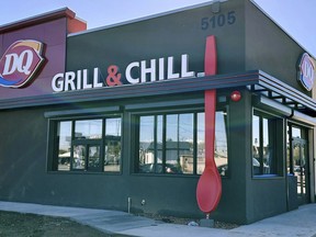 This undated image provided by Raman and Puja Kalra shows their Dairy Queen franchise restaurant in Phoenix with 15-foot-tall red spoon. The owners remain perplexed -- and slightly amused -- as to why someone would steal the giant red spoon that adorned their restaurant.