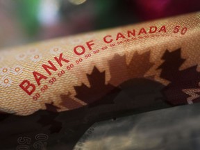 Bank of Canada wording on a Canadian $50 bill is pictured in Ottawa on Wednesday, Jan. 11, 2023.
