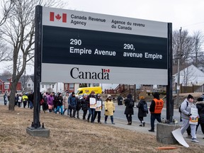 Workers stand in a picket line at the Canada Revenue Agency in St. John's, N.L.