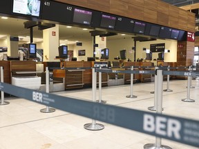 Interior view of an almost deserted terminal at BER Airport in Berlin, Germany, Monday, April 24, 2023. Employees at Berlin and Hamburg airports are staging walkouts in an ongoing dispute over pay and conditions for security staff, leading to flight cancellations in both German cities.