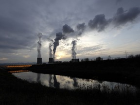 FILE - smoke rises from chimneys of the Turow power plant located by the Turow lignite coal mine near the town of Bogatynia, Poland, on Nov. 19, 2019. A scheme to develop small nuclear power reactors in Poland is moving forward, with a co-operation agreement between the Polish energy giant ORLEN and two U.S. government financial institutions. Poland, which has traditionally relied heavily on its own coal and Russian energy imports, is seeking a shift toward renewable and non-carbon energy.