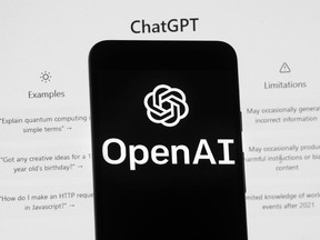 FILE - The OpenAI logo is seen on a mobile phone in front of a computer screen which displays the ChatGPT home Screen, on March 17, 2023, in Boston. ChatGPT's maker said Friday April 28, 2023 that the artificial intelligence chatbot is available again in Italy after the company met the demands of regulators who temporarily blocked it over privacy concerns.