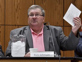 FILE - Rick Johnson chairs the committee as it meets before a capacity crowd in Lansing, Mich., June 26, 2017, at the first open meeting of the Michigan Medical Marijuana Board. Federal authorities said Thursday, April 6, 2023, that Johnson, the former head of a Michigan medical marijuana licensing board, accepted more than $100,000 in bribes and has agreed to plead guilty.