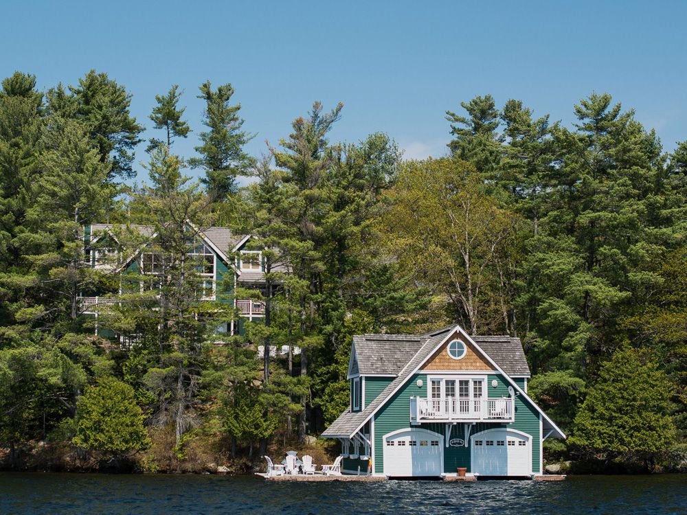 A large cottage stands on Lake Rosseau in Muskoka, Ontario.