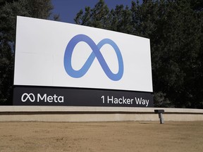 FILE - Facebook's Meta logo sign is seen at the company headquarters in Menlo Park, Calif., on, Oct. 28, 2021. Anyone in the U.S. who has had a Facebook account at any time since May 24, 2007, can now apply for their share of a $725 million privacy settlement that parent company Meta has agreed to pay. Meta is paying to settle a lawsuit alleging the world's largest social media platform allowed millions of its users' personal information to be fed to Cambridge Analytica, a firm that supported Donald Trump's 2016 presidential campaign.