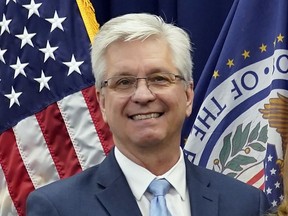 FILE - Federal Reserve Board of Governors member Christopher Waller poses for a photo on May 23, 2022, in Washington. Waller said Friday, April 14, 2023, that there has been little progress on inflation for more than a year and that more interest rate hikes are needed to get prices under control.